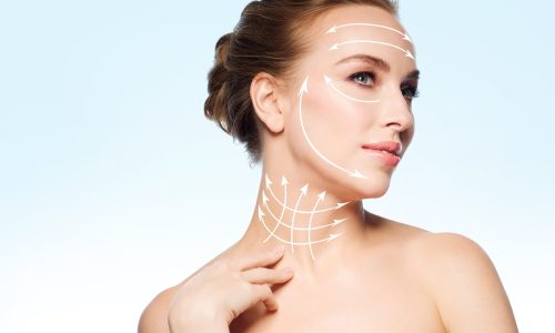 beauty, people, plastic surgery, anti-age and health concept - beautiful young woman touching her neck over blue background